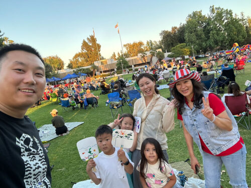 Sharon Kwan taking a picture with some Arcadia residents at the City 4th of July event.