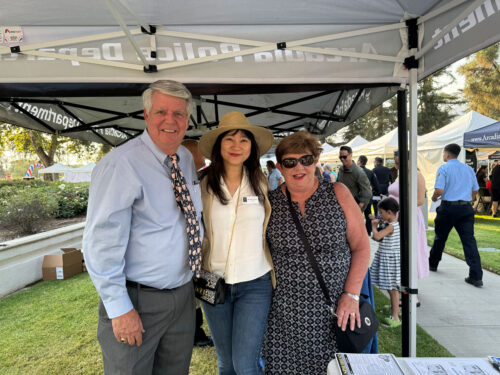 Sharon taking a picture with Jack and April Oswell with the Arcadia Police department