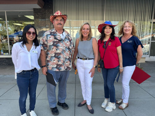 Sharon Kwan taking a picture with Los Angeles Supervisor Kathryn Barger, Vicky Paul, Peter Amundson.